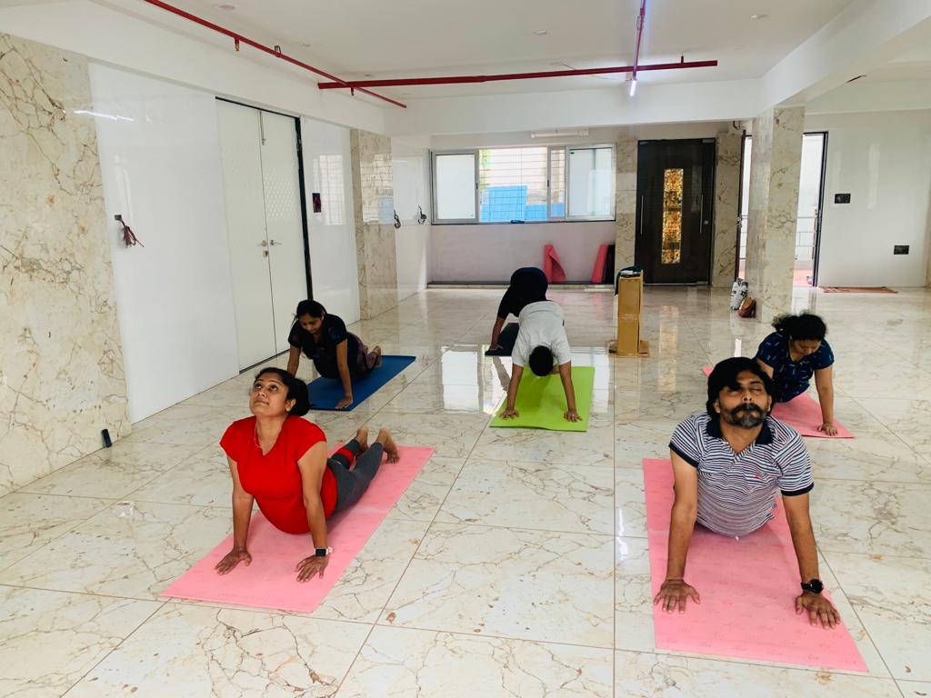 Yoga instructor guiding students in Pune